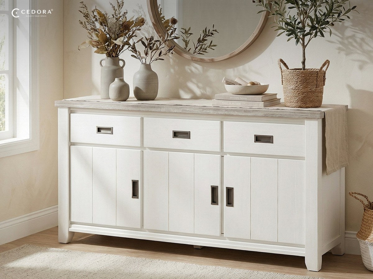 Byron sideboard in white with a pale timber top, styled with vases and an olive tree beneath a round mirror