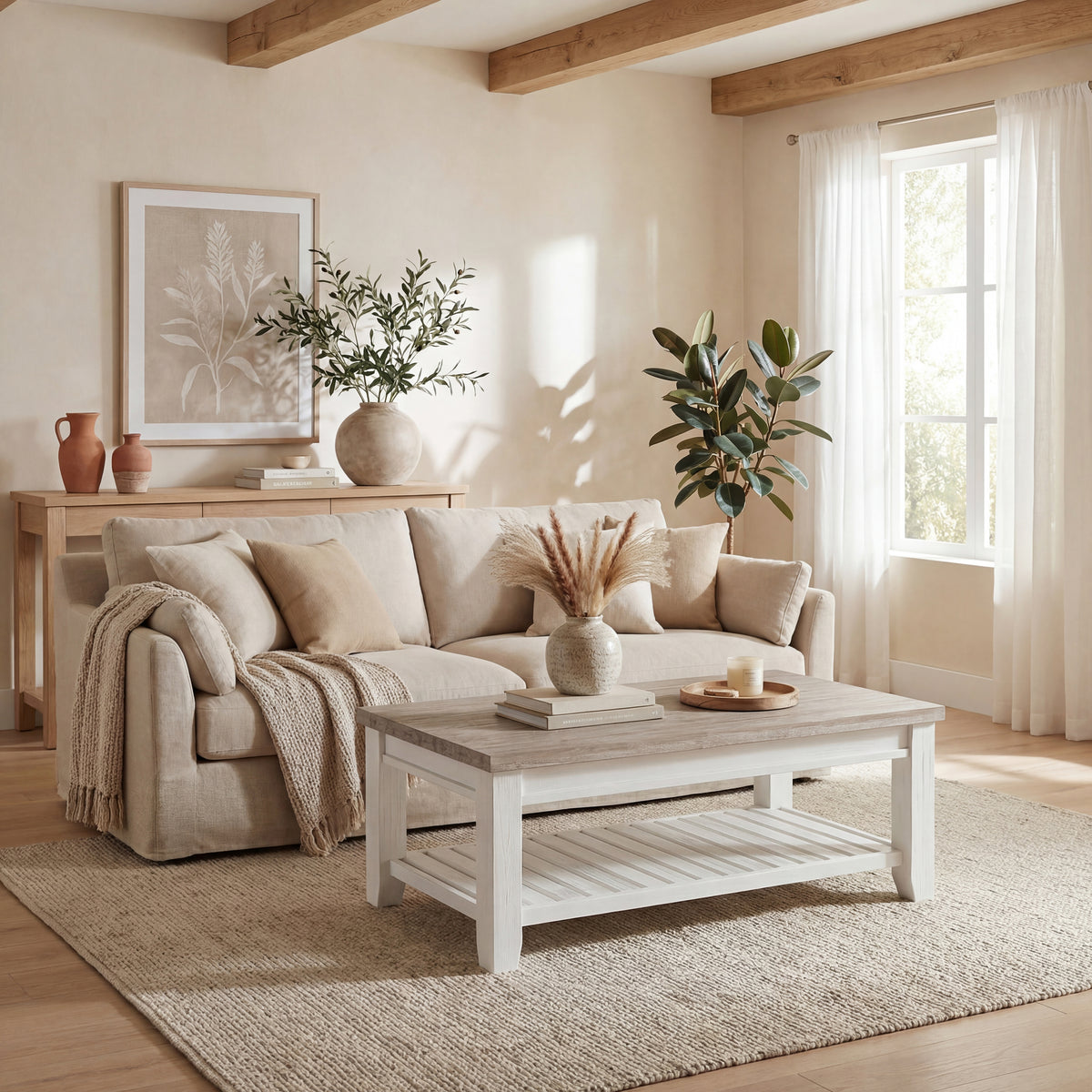 Byron Acacia Coffee Table in front of a linen sofa, topped with a vase of dried pampas and a tray