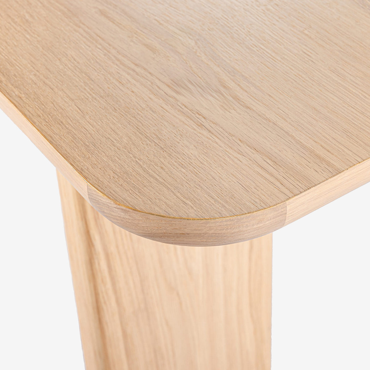 Close-up of a wooden stool with a light finish on a white background

