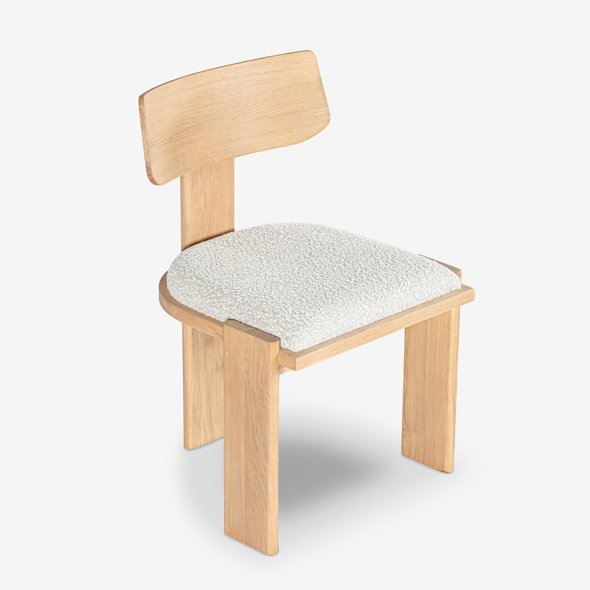 Wooden chair with a white cushioned seat on a white background

