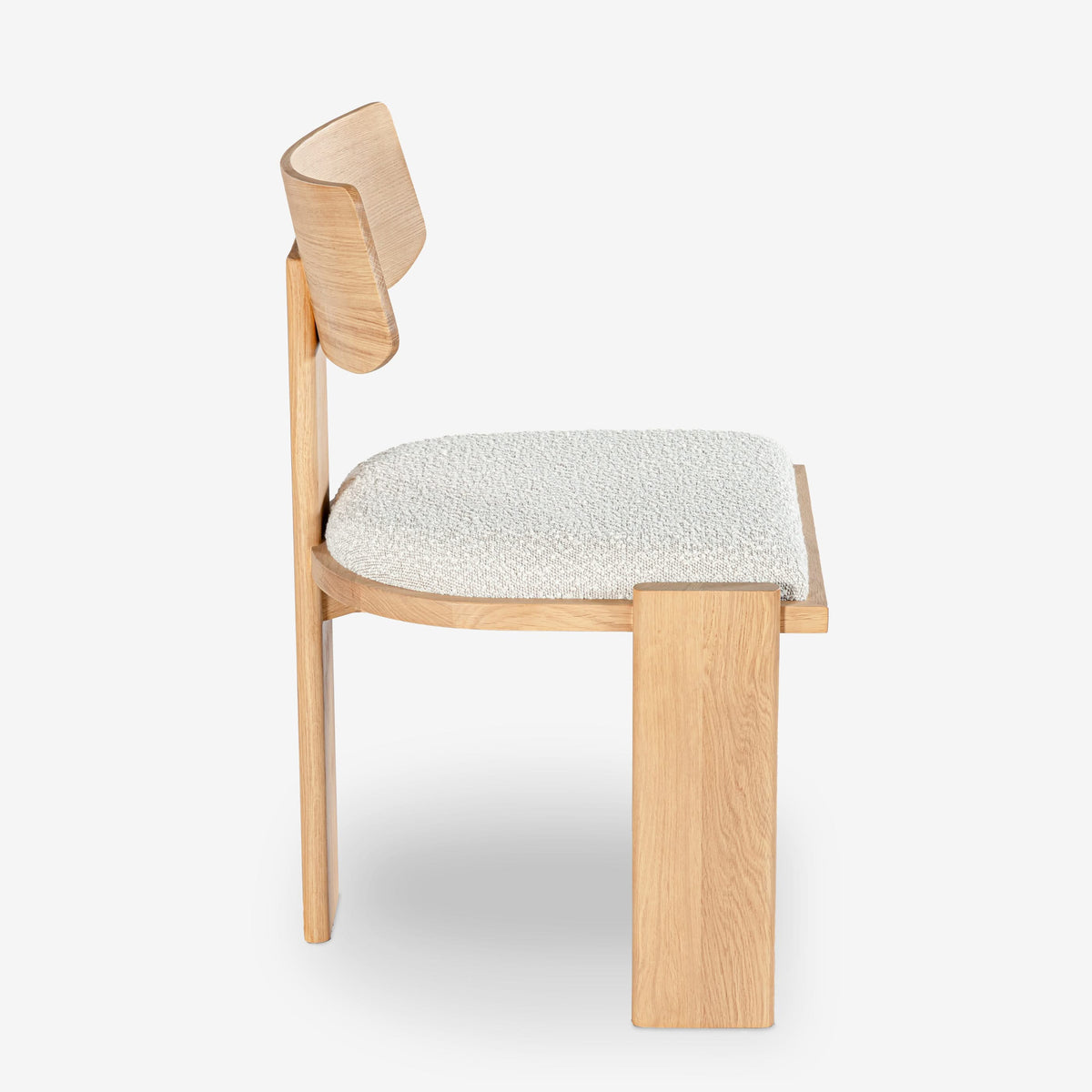 Wooden chair with a textured white cushion on a white background

