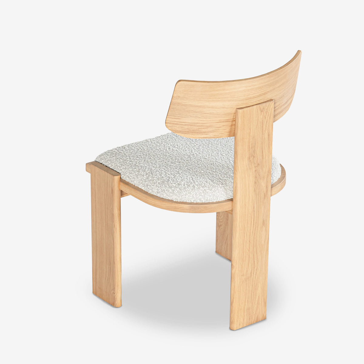 Wooden chair with a textured seat on a white background

