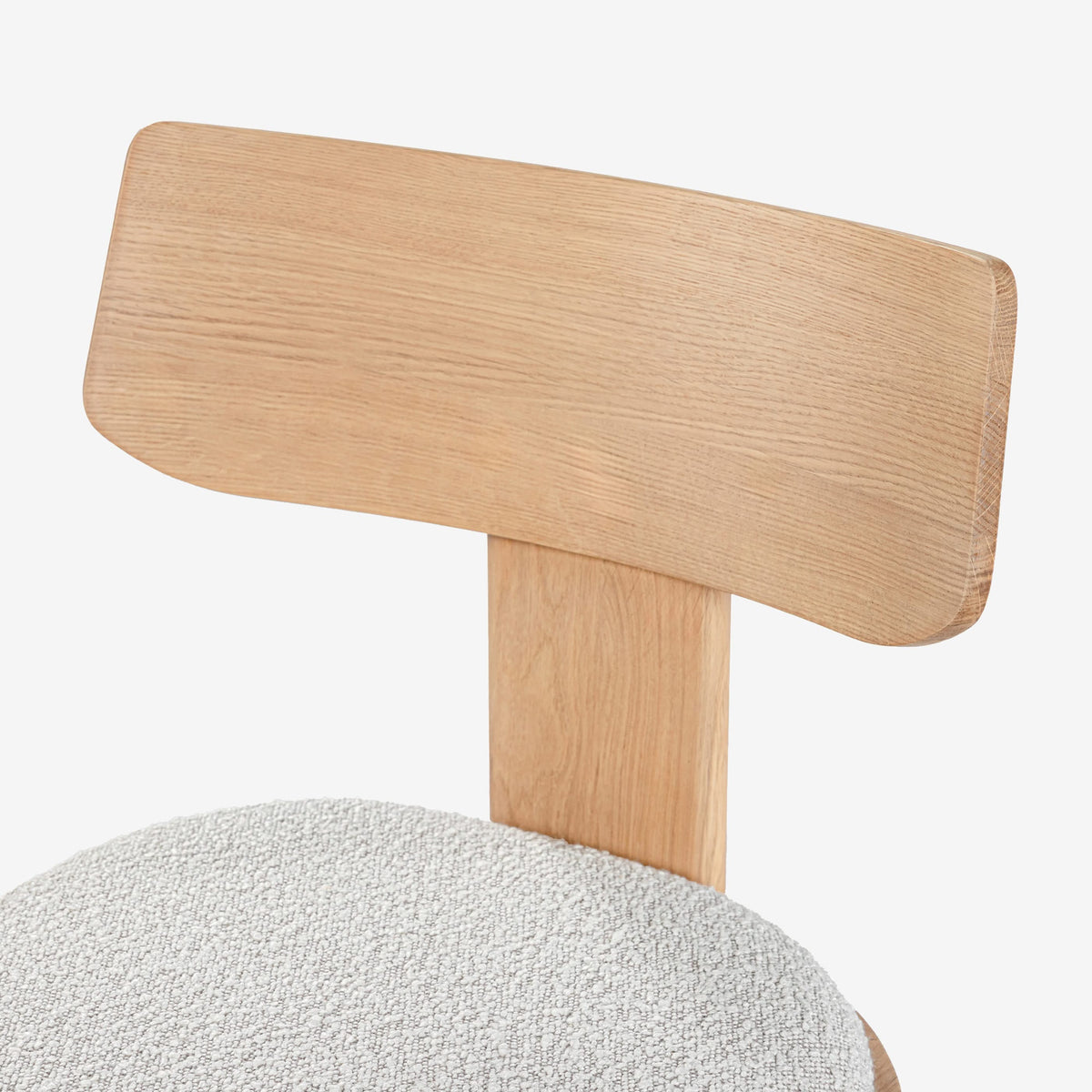 Close-up of a chair with a wooden backrest and gray seat on a white background

