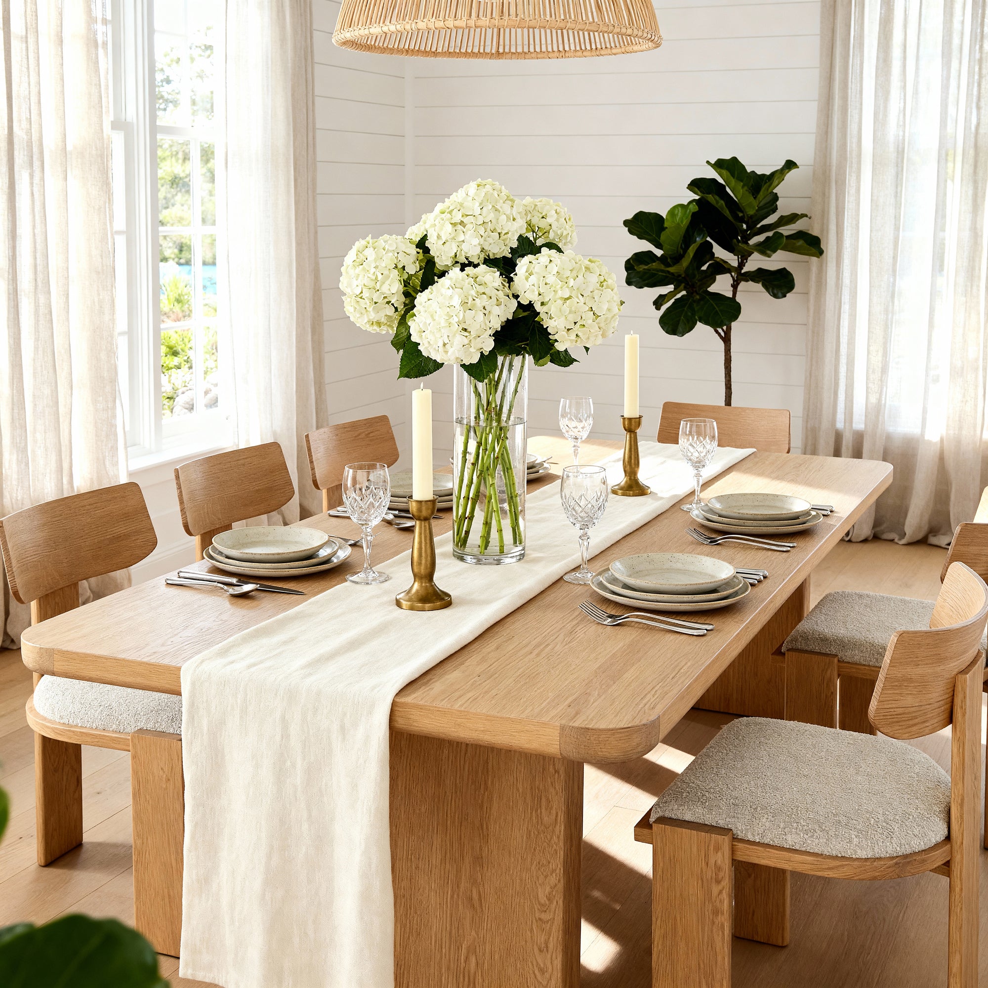 Liverpool Pine Dining Table 240cm with 8 Chairs - Natural laid with hydrangeas and taper candles against a panelled wall