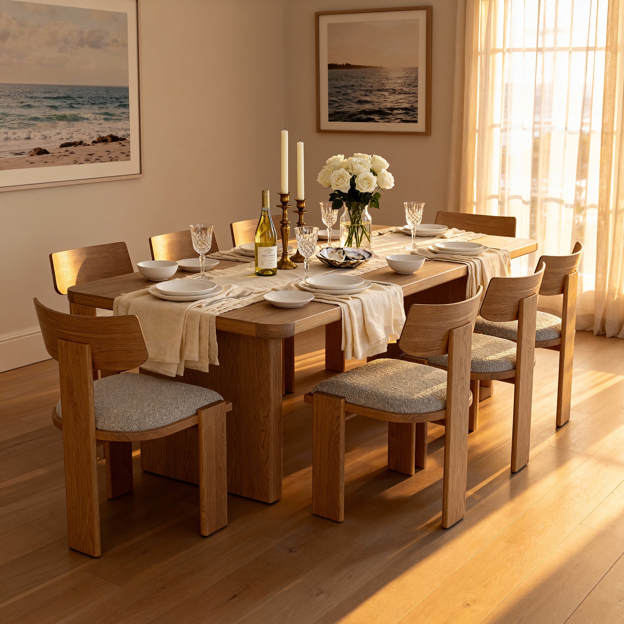 Liverpool Pine Dining Table 240cm with 8 Chairs - Natural set with roses and taper candles below framed ocean prints