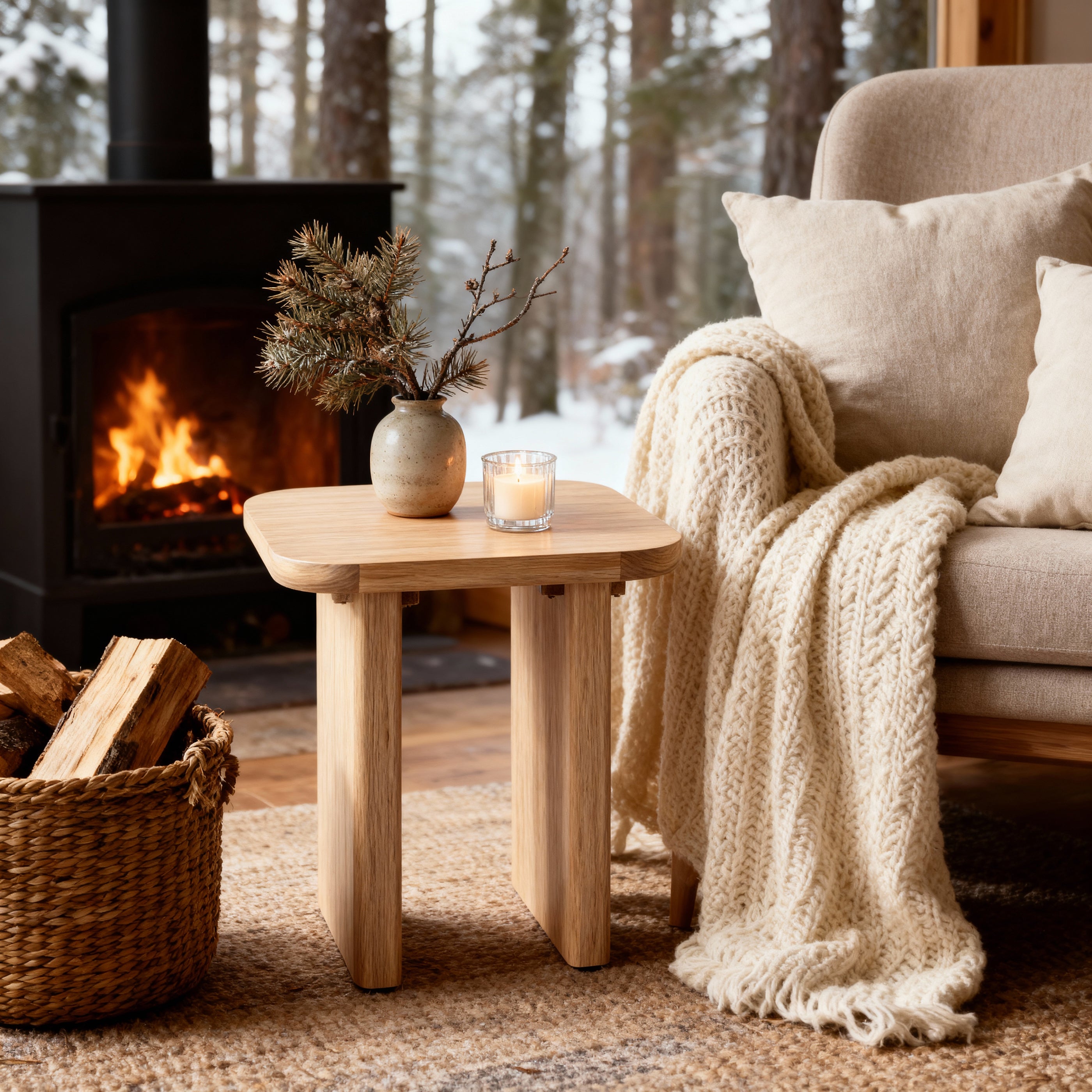 Cozy living room with fireplace, wooden table, and armchair with blanket

