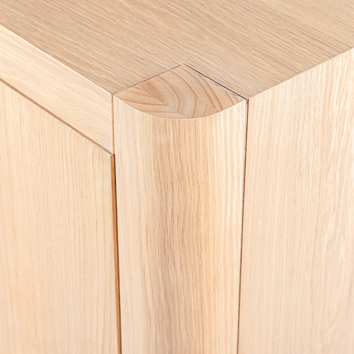 Close-up of a wooden panel with a visible grain pattern

