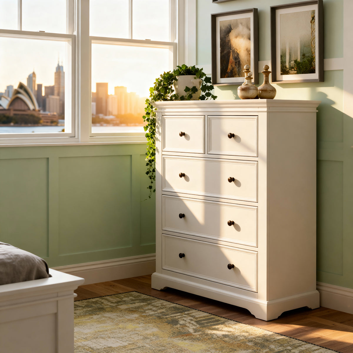 London Pine 5 Drawer Tallboy in a bedroom with green panelling, by a window overlooking the Sydney Opera House