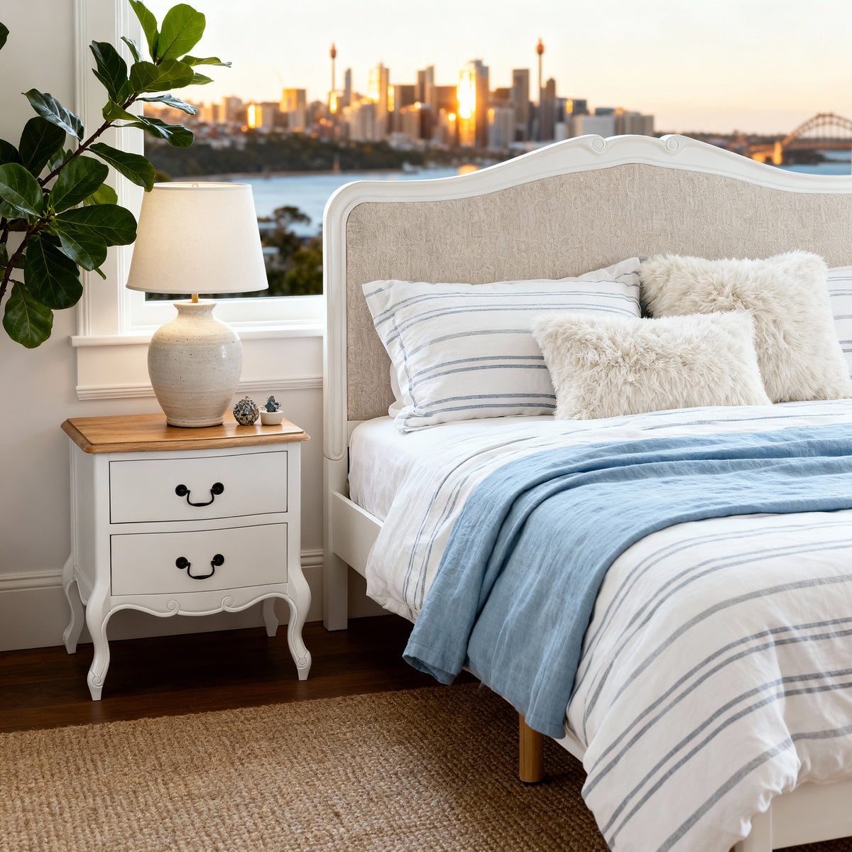 Newcastle Acacia Double Bed Frame shown in close-up with its upholstered headboard, by a window overlooking Sydney Harbour