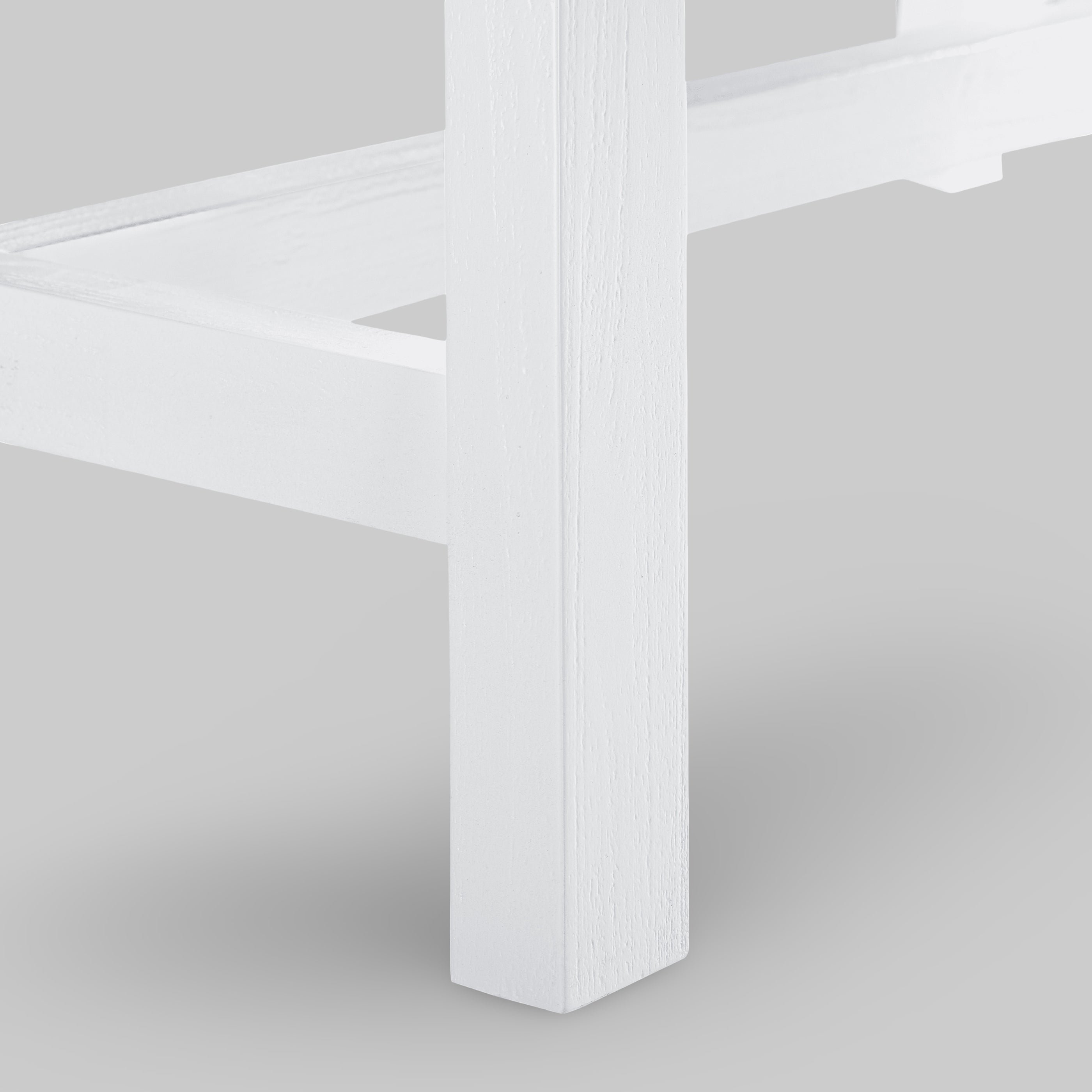 Close-up of a white chair leg on a light gray background

