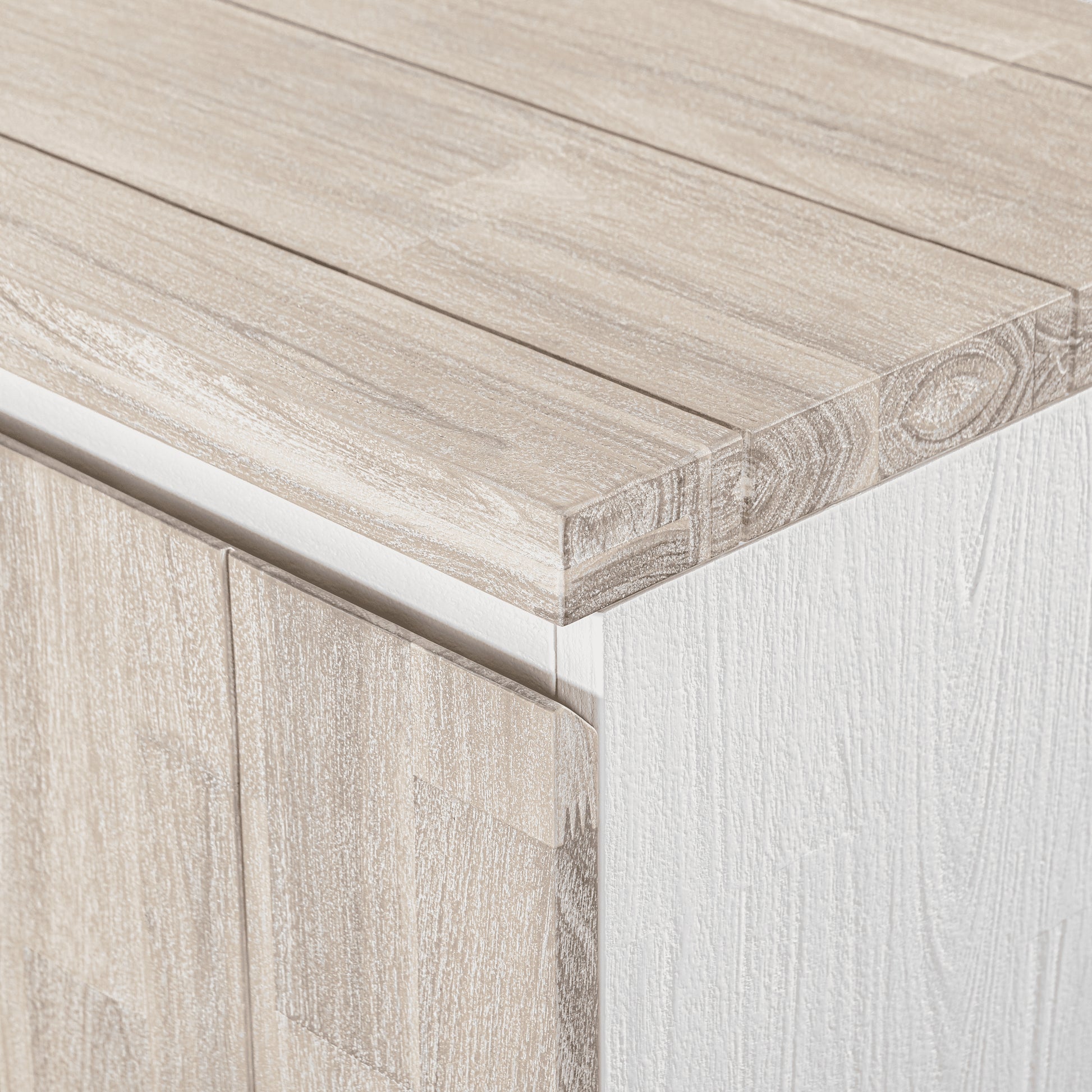 Close-up of a wooden surface with a white baseboard

