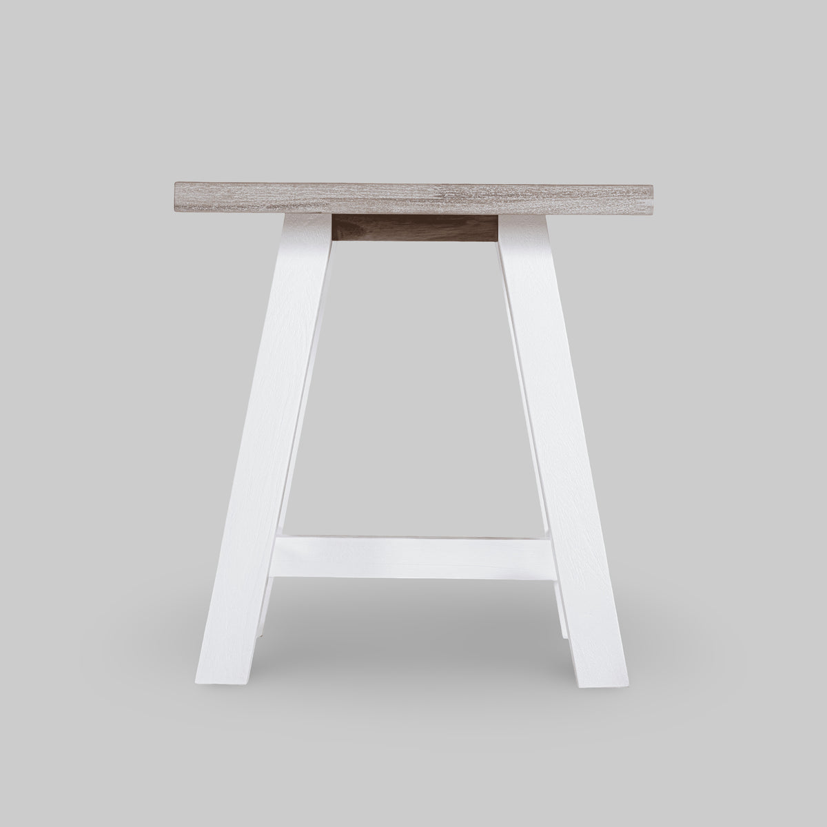 Wooden stool with white legs on a light gray background

