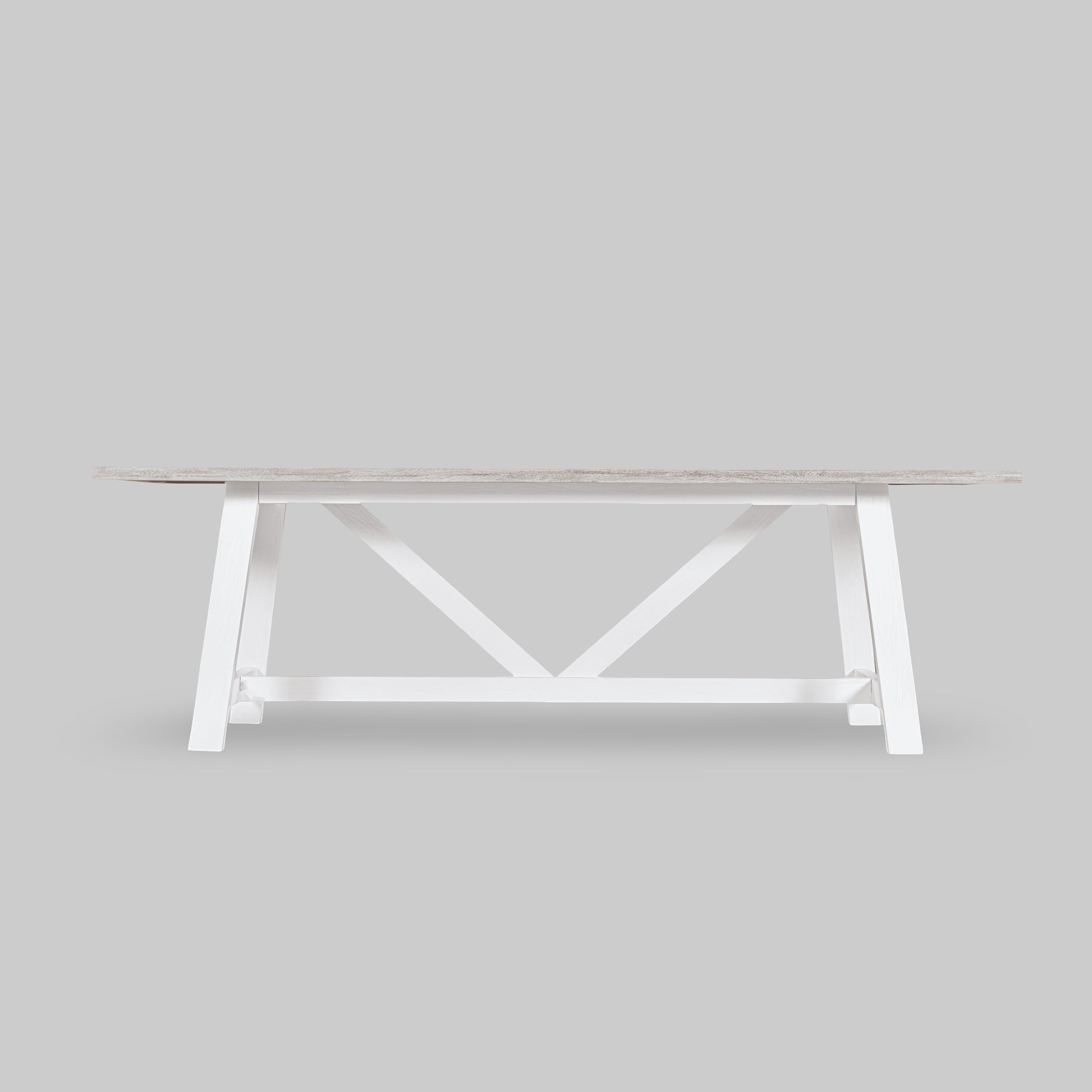 White wooden table with a minimalist design on a light gray background

