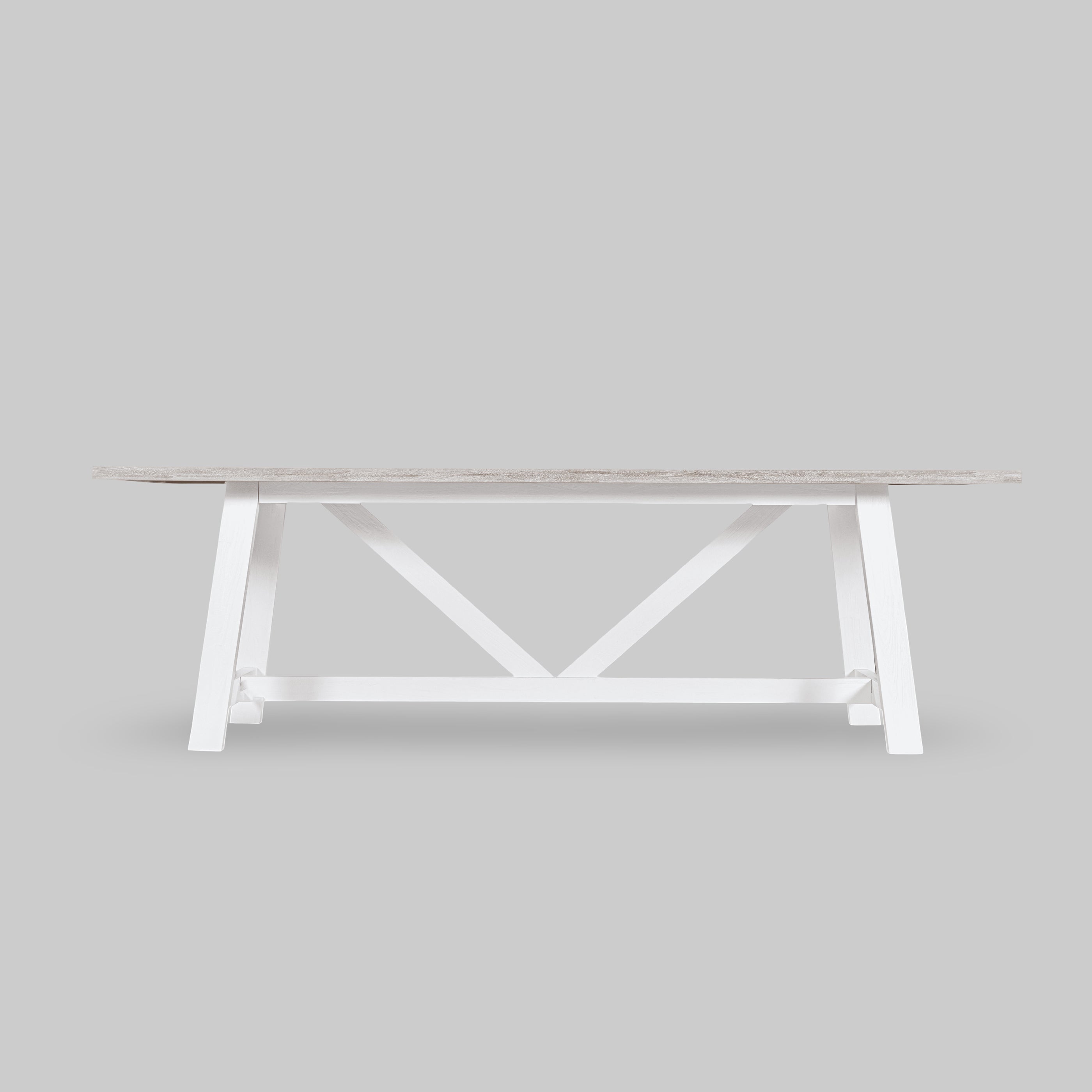 White wooden table with a minimalist design on a light gray background

