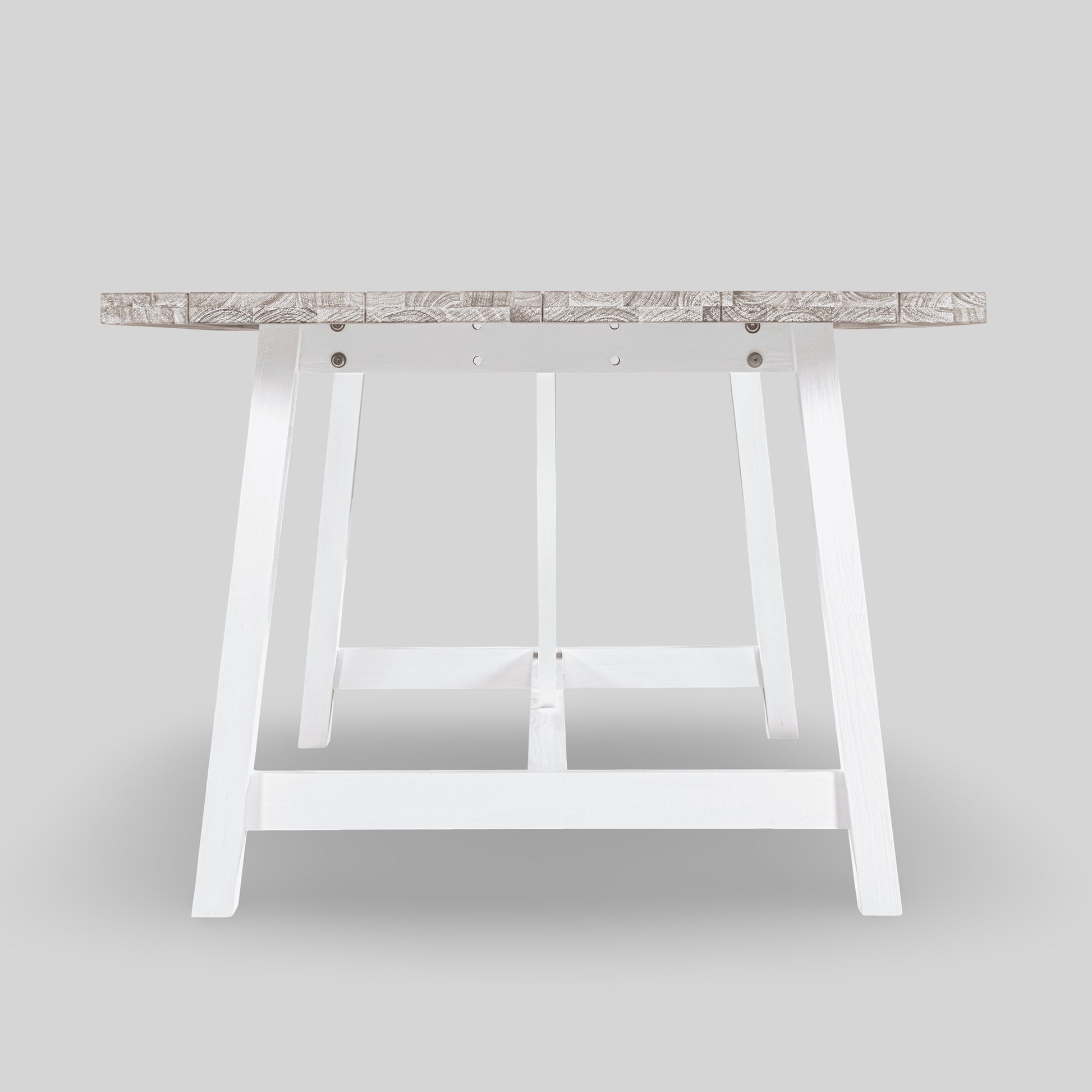 Wooden table with white metal legs on a light gray background

