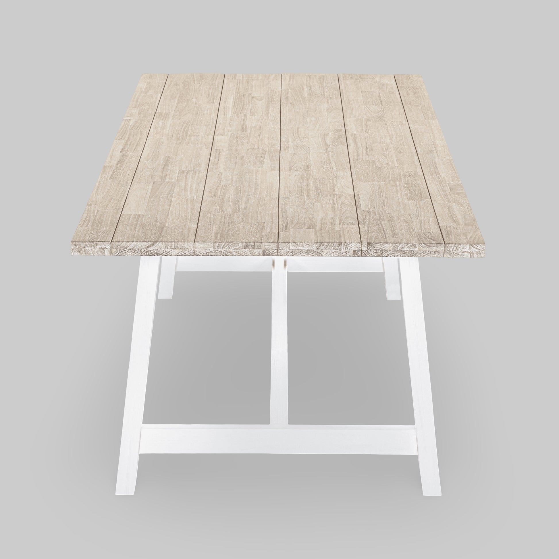 Small wooden table with a white base on a gray background


