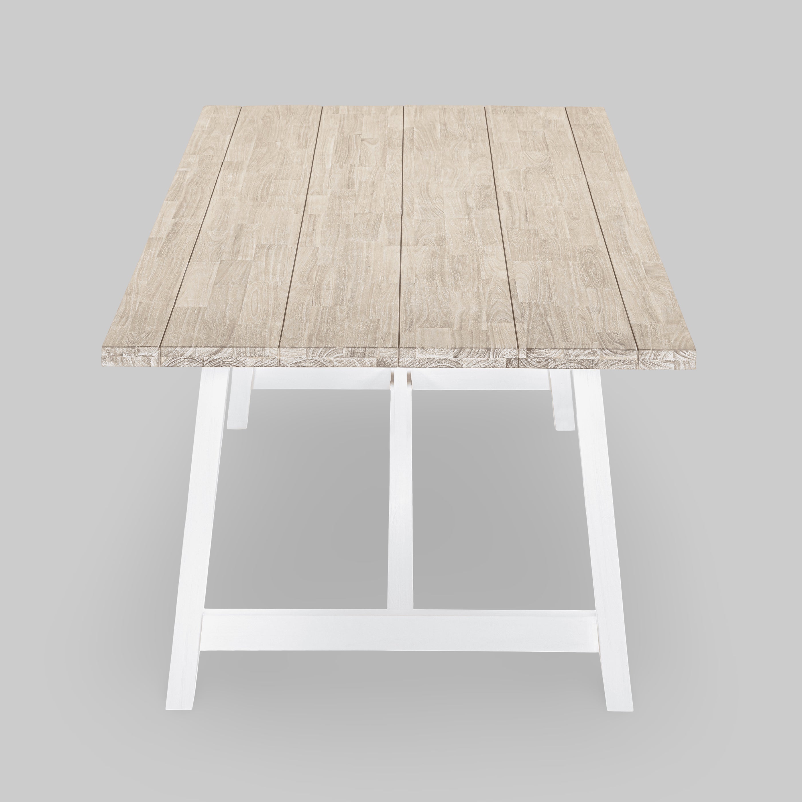 Small wooden table with a white base on a gray background

