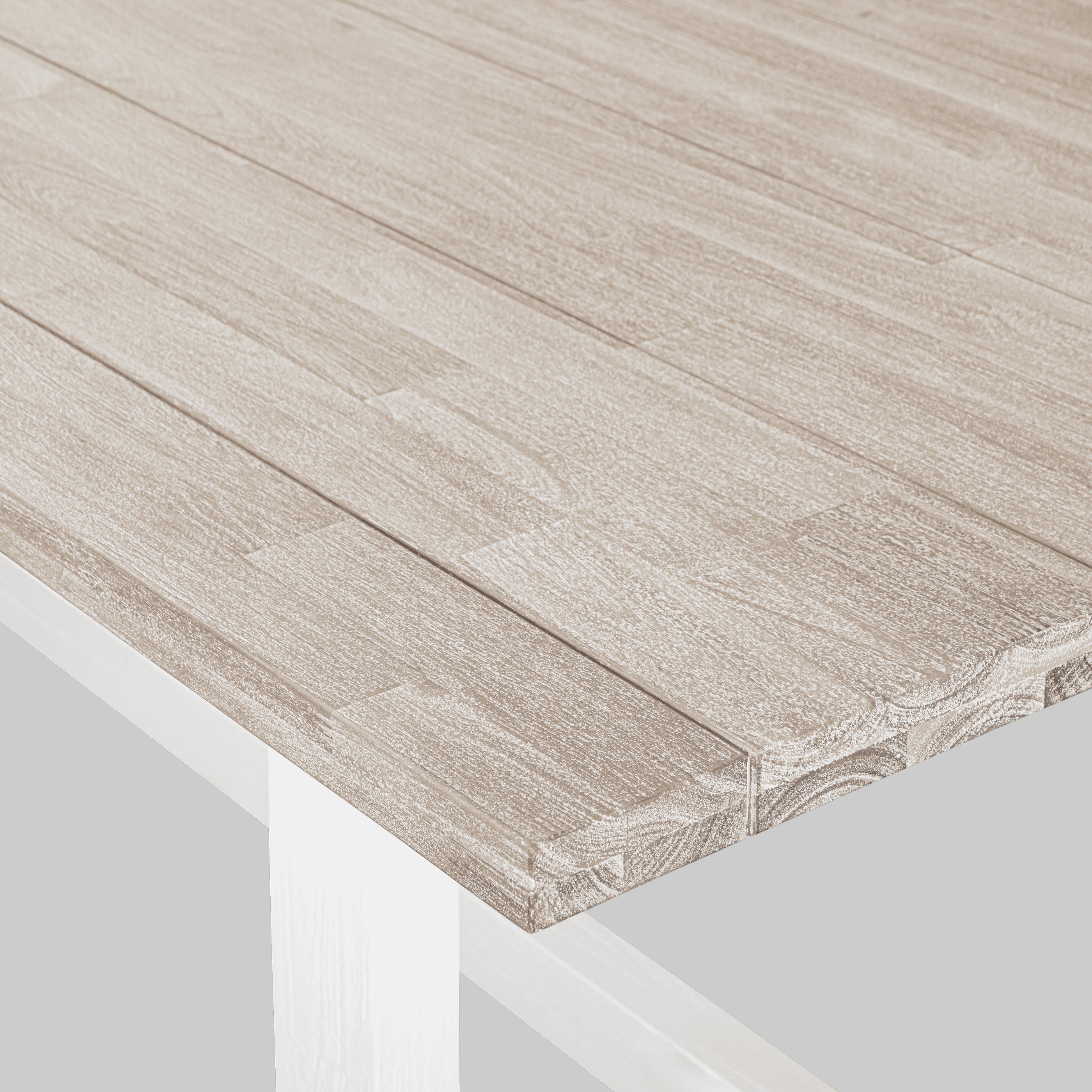 Close-up of a wooden surface with a white base

