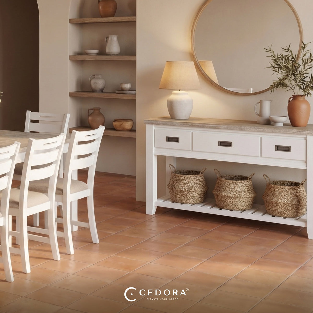 Byron Acacia 3 Drawer Console Table holding woven baskets beneath a round mirror on terracotta tiles