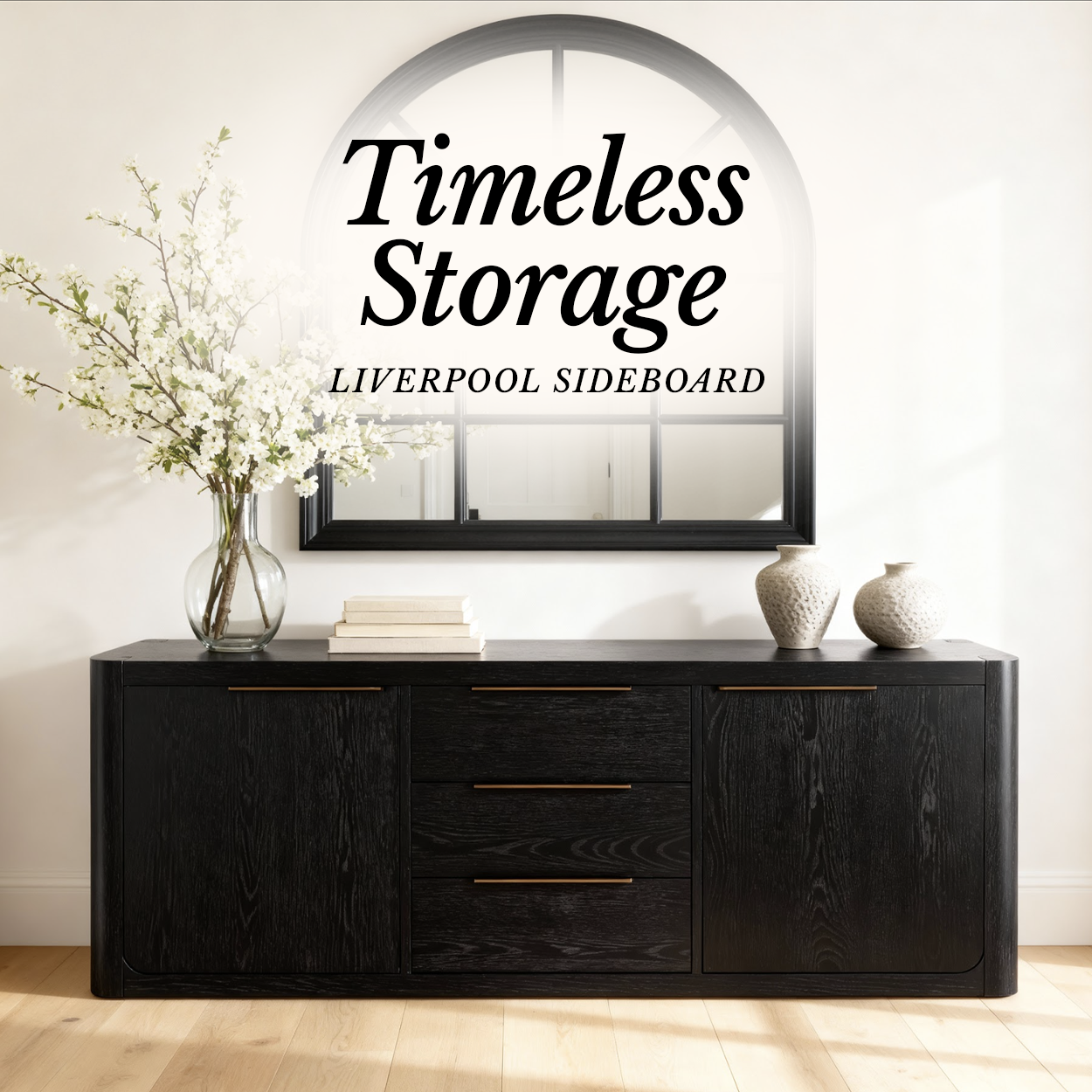 Liverpool Pine 2 Door 3 Drawer Sideboard - Black styled with blossom stems below an arched mirror, in a Cedora advert