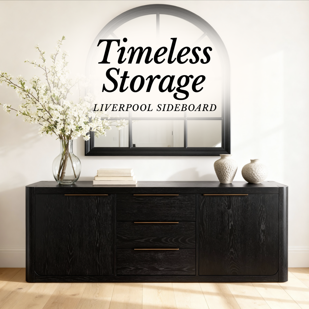 Liverpool Pine 2 Door 3 Drawer Sideboard - Black styled with blossom stems below an arched mirror, in a Cedora advert