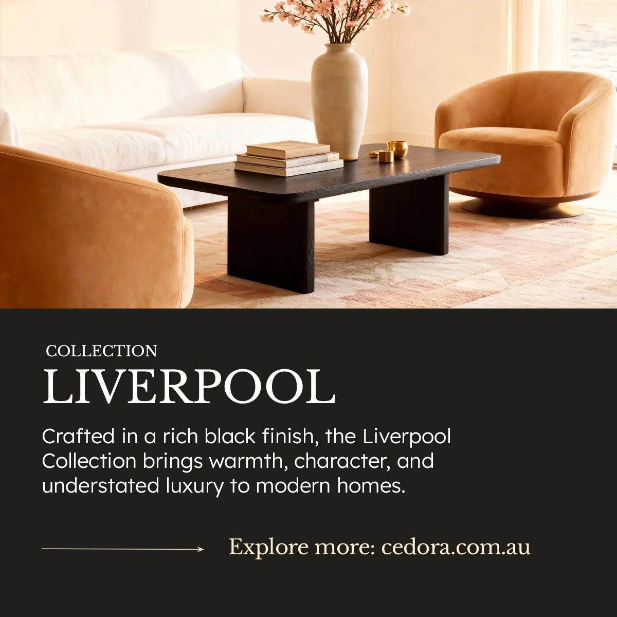 Liverpool Pine Coffee Table - Black stacked with books between tan velvet armchairs, in a Cedora Liverpool Collection advert