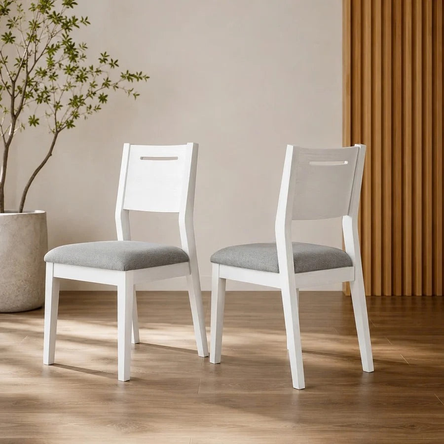 Oxford Acacia Dining Chair Set of 2 shown as a pair beside a potted olive tree against a fluted timber wall