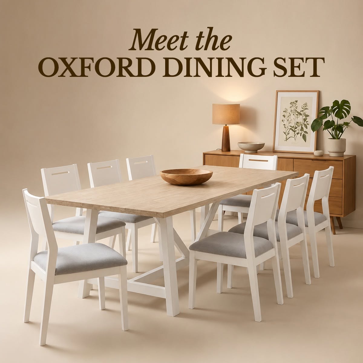 Oxford Acacia Dining Table 240cm laid with a wooden bowl before a sideboard, in a Cedora advert
