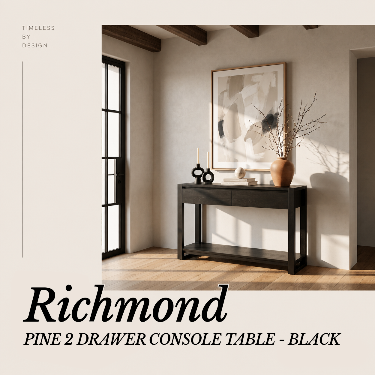 Richmond Pine 2 Drawer Console Table - Black in an entryway with abstract art and a vase of stems, in a Cedora advert