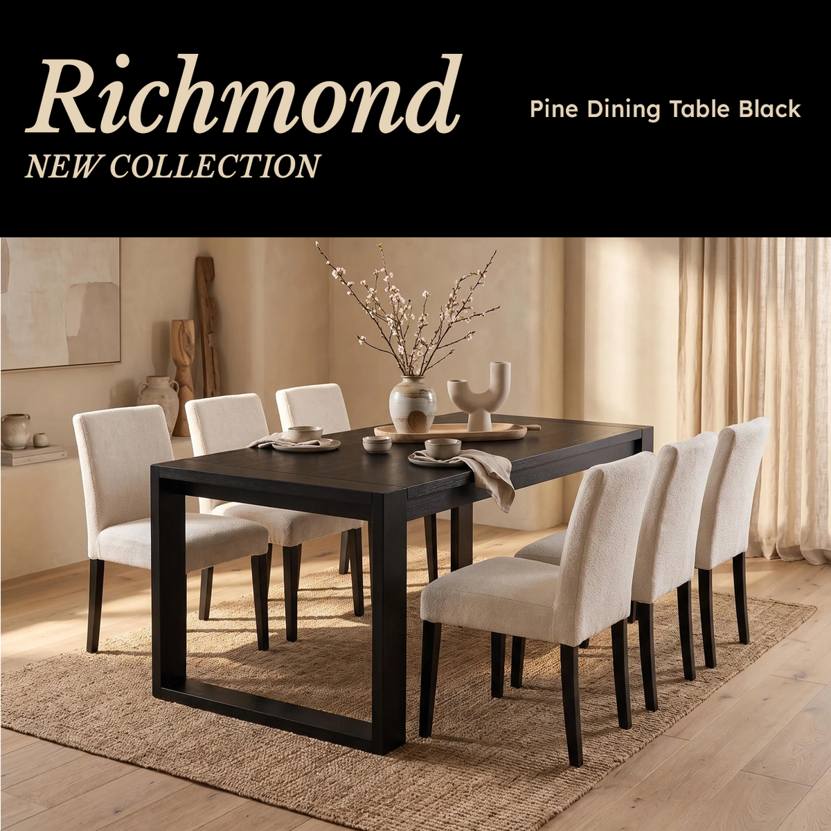 Richmond Pine Dining Table - Black laid with a vase of blossom and six cream chairs
