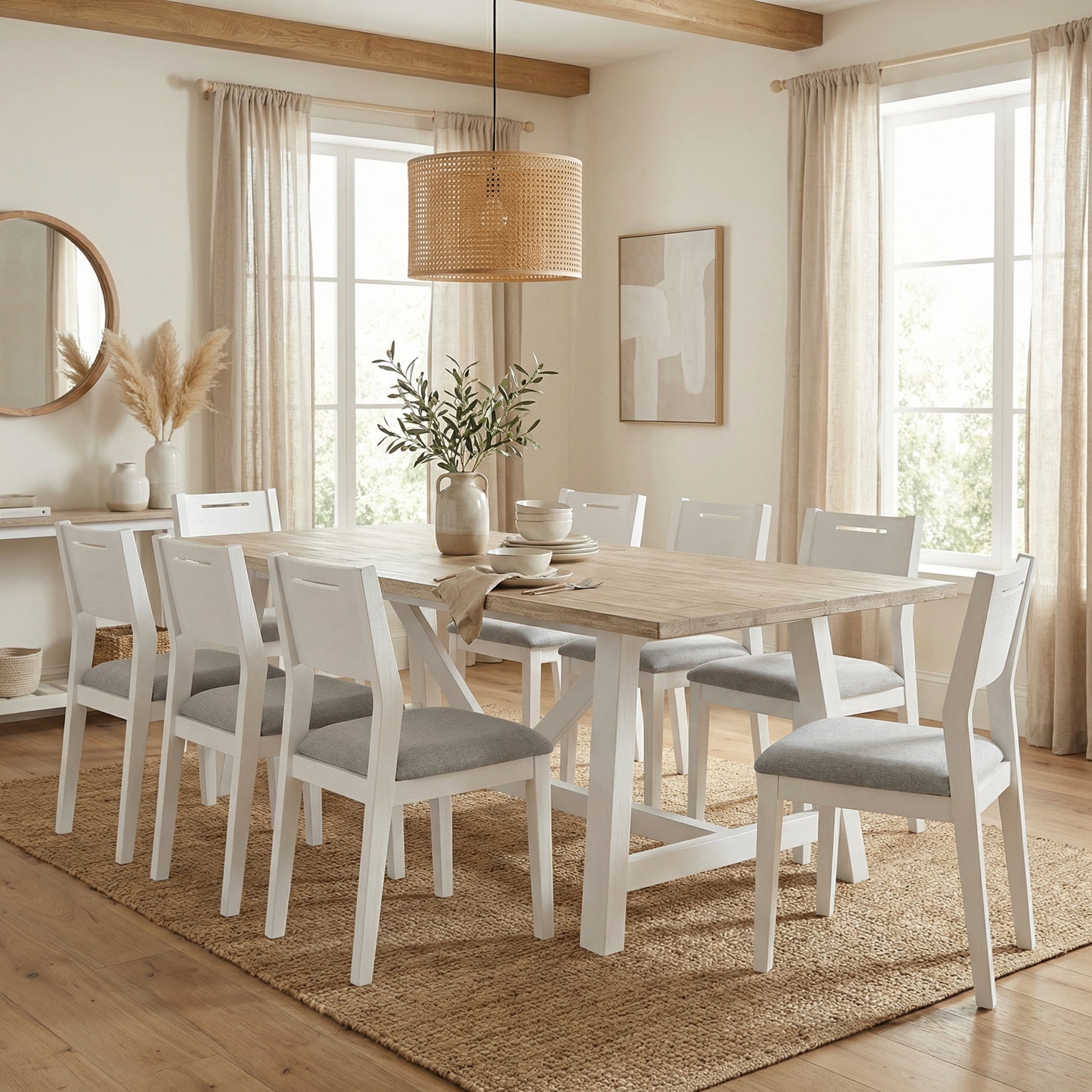 Dining room with wooden table and chairs, large windows, and decorative elements.

